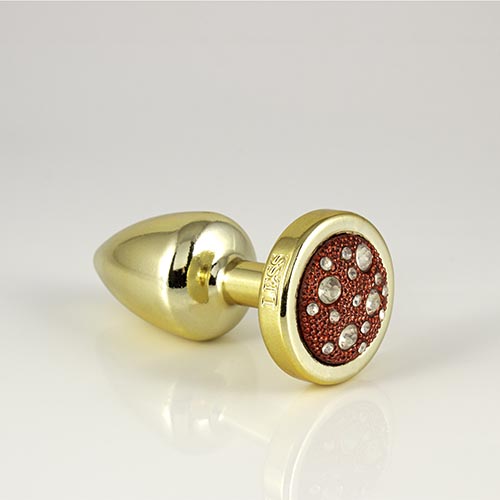 Plug LESS P (ABS) Dourado com Pedra Cravejada Vermelha