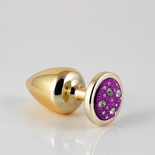 Plug LESS M (ABS) Dourado com Pedra Cravejada Lilás